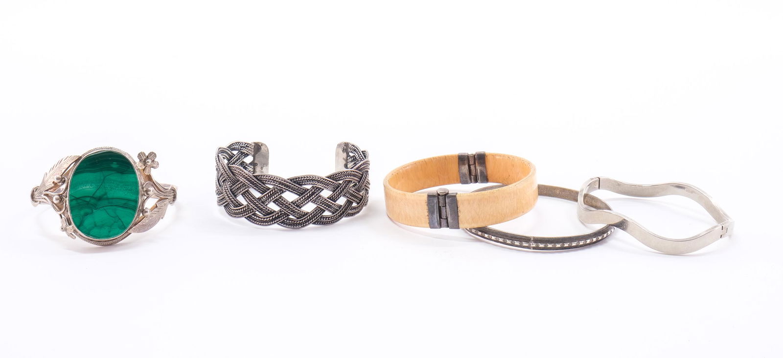 Five Cuff and Bangle Bracelets: Includes Braided marked 925, a large malachite with floral design on the frame, no markings. Both in good wearable condition. 3 bangles 1 marked Coro and sterling, another marked 925, and the 3rd is m