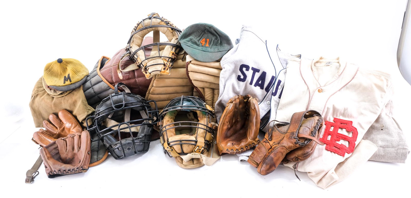 Vintage Baseball Apparel: A Sear's brand long gun Ted William's carry case in very good condition. 4 1930's - 1940's catcher or umpire chest shields. 3 umpire or catcher face masks. 2 small wool felt beanie caps, they both hav