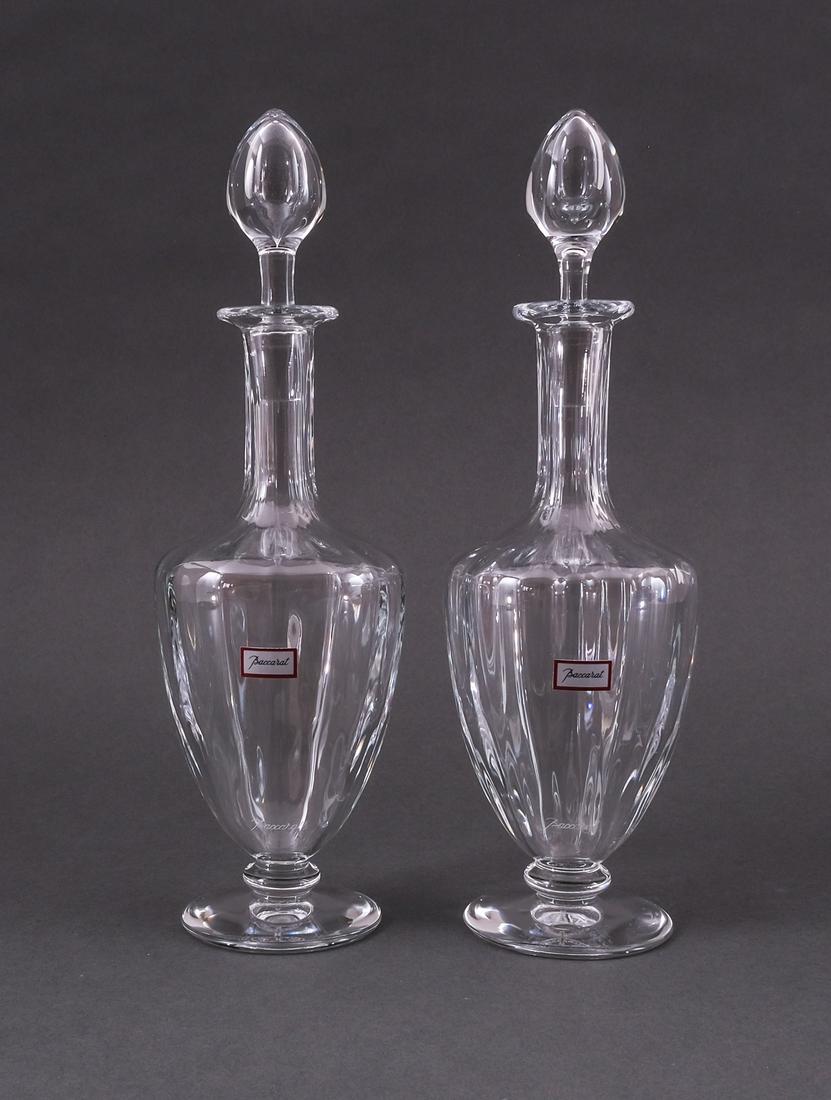 2 Baccarat Crystal Capri Cordial / Small Decanters: 2 Signed Baccarat crystal decanters for cordials, spirits, or fine liquors. Capri pattern. Baccarat stickers present. Good condition, no visible nicks or chips. 10 1/8" tall (including topper) by 3" w