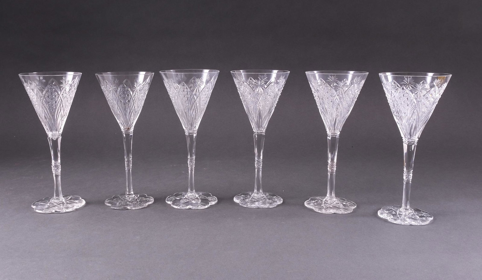 Set of 6 Baccarat Crystal Elbeuf Glasses: Set of six signed Baccarat cordial glasses for cordials, spirits, and fortified wines (sherry, port). Elbeuf pattern, with cut glass decoration. Good condition. One glass has Baccarat sticker. 6 5/8" 
