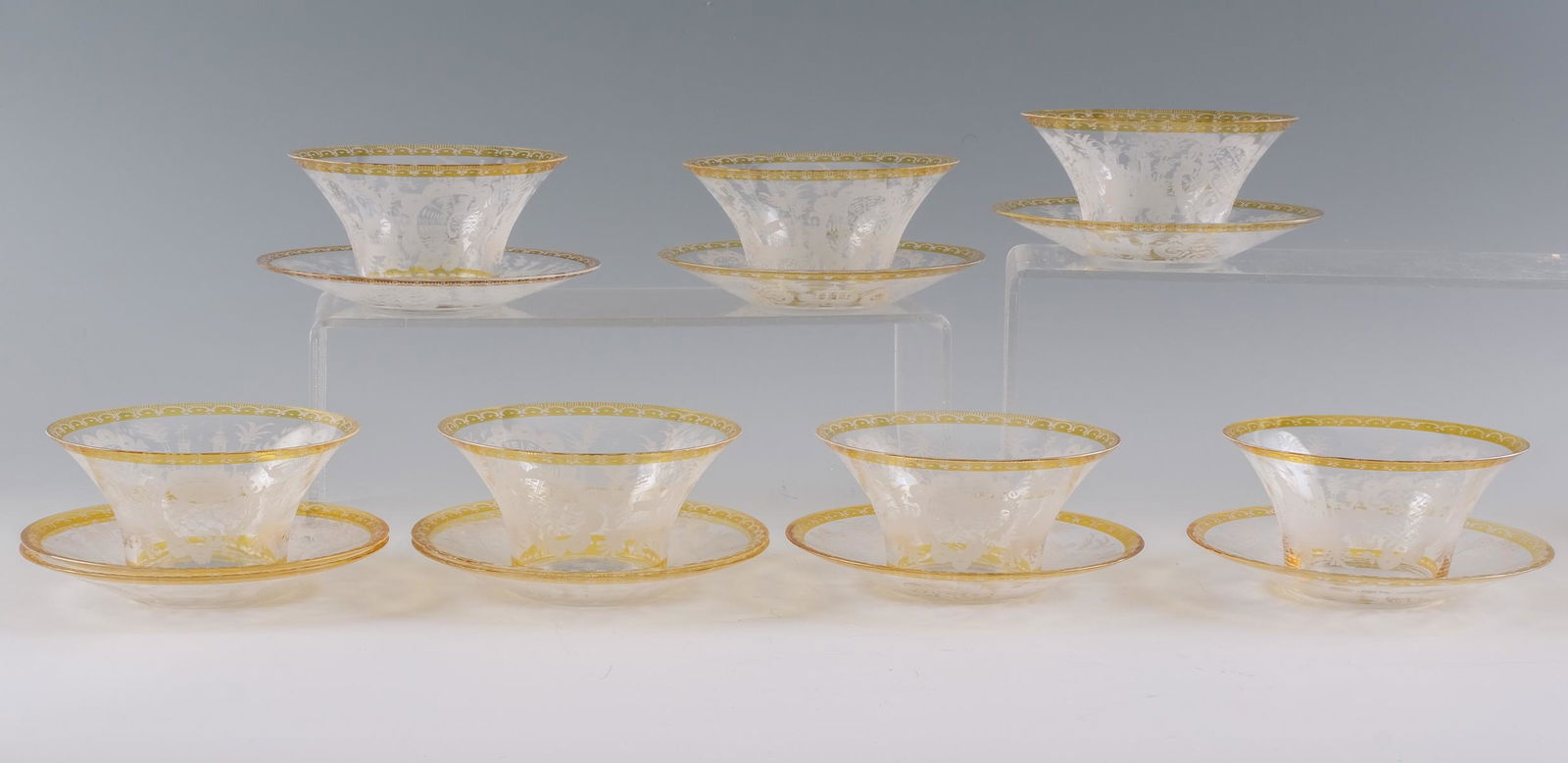 27 Pieces - Bohemian Glass Bowls & Underplates: 27 pieces of Bohemian glass bowls and under plates. Bohemian (Czech), ca. late 19th - early 20th century. 12 bowls and 15 under plates. All have etched floral, dog, and castle designs. Clear glass wit