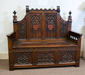 Belgian Gothic Revival Hall Bench: Wooden hall bench in the Gothic Revival style, marked on back "Made in Belgium". Belgian, ca. late 19th - early 20th century. Dark stained wood. Decorated with various Gothic elements, such as lancet