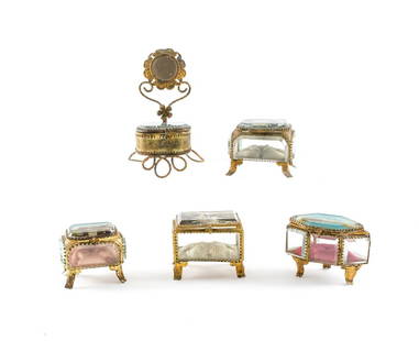 Five Small Jewel Caskets: 5 vanity top jewel caskets with travel postcards inserted in lids. Largest Dimension 6" Beveled Glass and Gilt Metal mounts. All the glass is in good condition free of chips, cracks and repairs. 