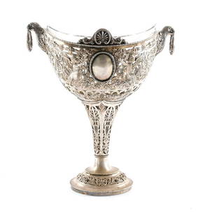 Ornate E.G Webster & Son Silverplate Compote: Ornate silverplate compote with glass insert by E.G. Webster and Son of Brooklyn, NY. American, ca. late 19th - mid 20th century. Weighted base. Compote includes winged figures and floral and vegetal