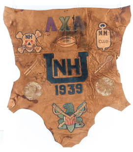 UNH Fraternal Leather Banner: University of New Hampshire leather banner for the Lambda Chi Alpha fraternity. American, 1939. Sewn patches show the UNH logo, the date, the Greek letters of the fraternity's name, an United States E