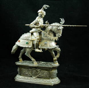 German 800 Silver Jousting Knight w/ Ivory face: Of excellent quality, 12" x 13" overall, with traces of gold gilt remaining, cabochon gems, unidentified hallmarks: possibly Hanau, Helmet top has been repaired and glued some time ago, it is currentl