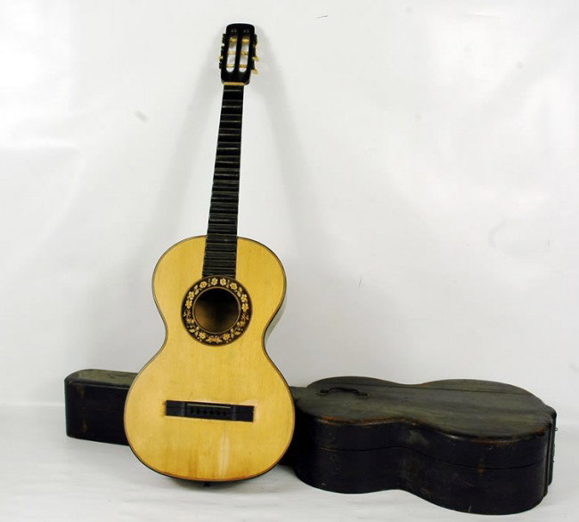 Early French Romantic Guitar mid-19th C.: This is an excellent guitar in unfortunate condition and will need serious restoration. When found in the estate it was strung with steel strings that broke the winding posts on the Ivory & Brass Tune