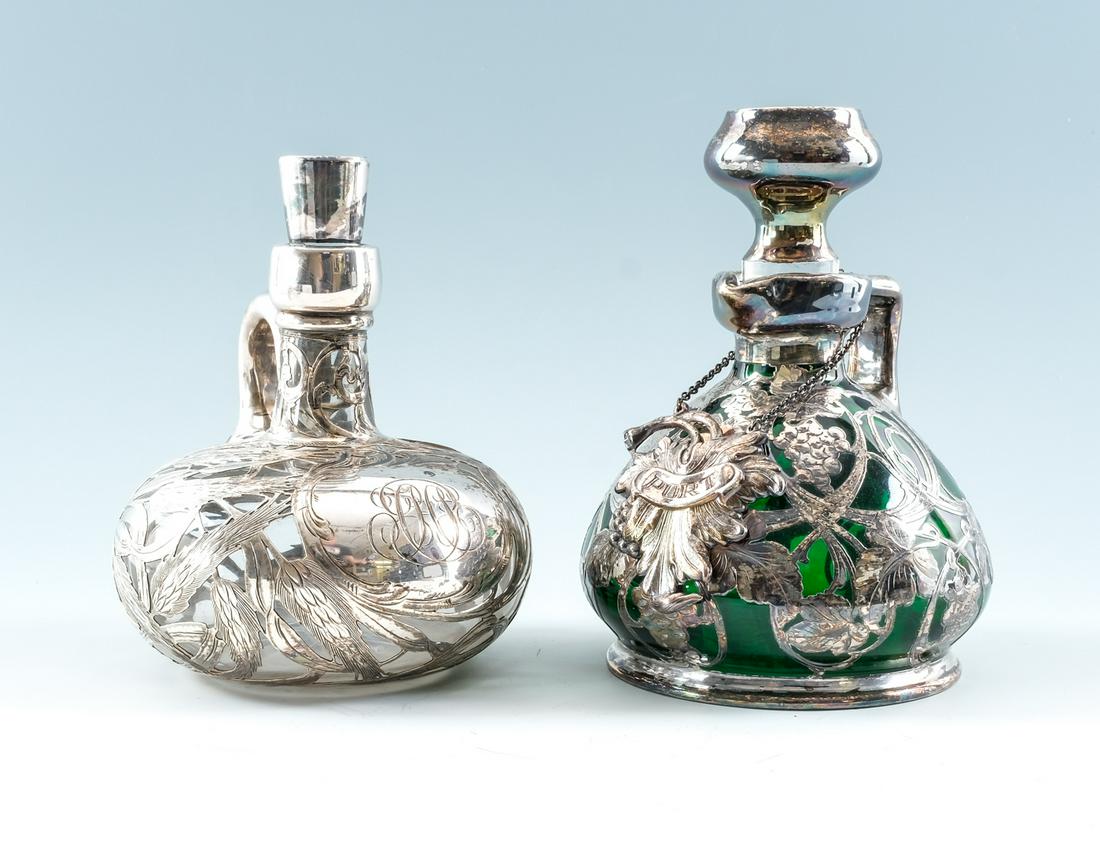 Pair of Silver Overlay Glass Decanters: Pair of silver overlay decanters. Likely American, ca. late 19th - mid 20th century. Glass decanters with high purity silver overlay. One includes a silver plate tag, reading "Port". Monogrammed / ini