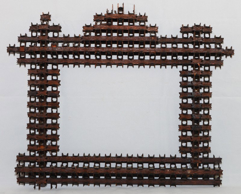 Tramp or Folk Art Frame: This is a nice tramp or folk art handmade frame. It is very intricate and even more delicate. Its made of thinly cut and slightly sharp wood pieces. This took a long time to create.&