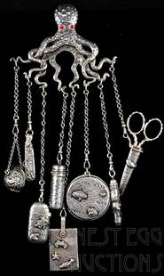 19th C. Gorham Sterling silver Chatelaine: This impressive chatelaine was made by the Gorham Silver co. in the late 19th C. Featuring an octopus with red glass eyes, and eight ladies accessories. Hallmarked with the numbers 145, STERLING and t