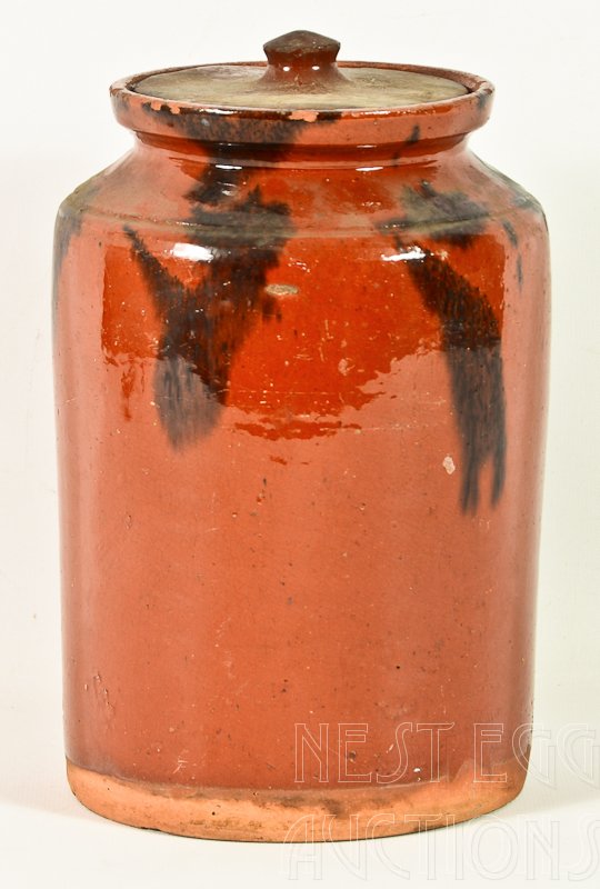 Redware Canister: Redware canister, nice glaze, good color. This item is in nice shape overall for its age. It does have some minor chips around the rim as is to be expected, from