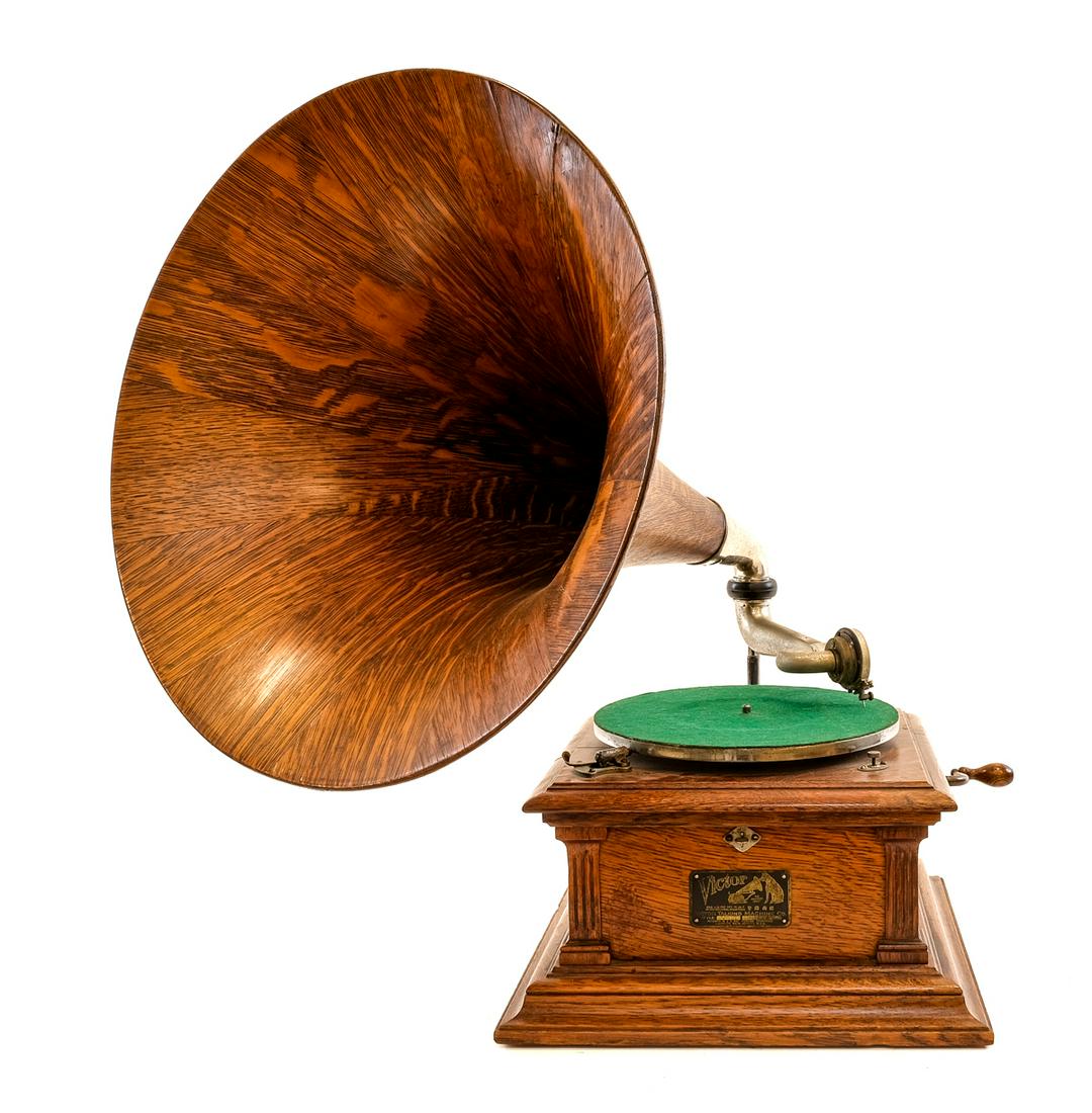 Victor Victrola III Disc Phonograph: Disc player. Serial # 22489. Circa 1903-1909. Tested, plays. There is a slight wobble to the turntable which affects playback but not distractingly. Finish appears original. Exhibits wear consistent w