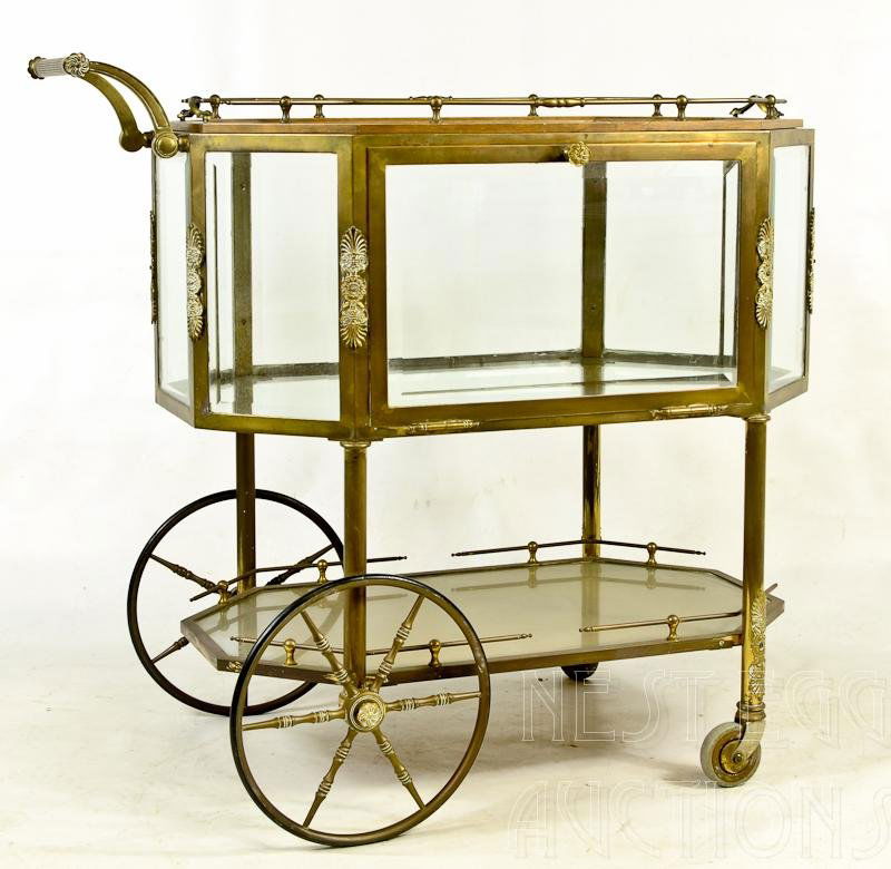Beveled Glass Regency Brass Tea Cart: This tea cart is a beautiful Regency style period example. Heavy beveled glass, lovely ornamentation, and completely functional, with removable gallery tray, and hinged door over second shelf.&n