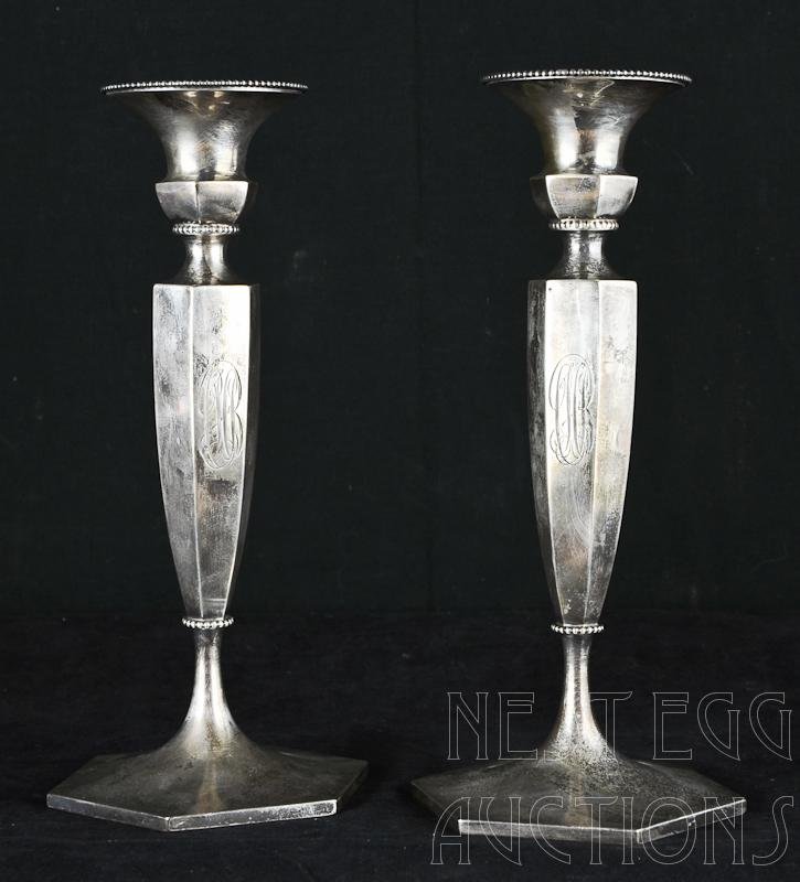 Pair of Theodore B. Starr Sterling silver Candlesticks: Pair of sterling silver candlesticks, produced by Theodore B. Starr. Patented 1894, marked sterling, 4520, and dated April 20th, 1897. Each measures approximately 10" x 4.5".&nbs
