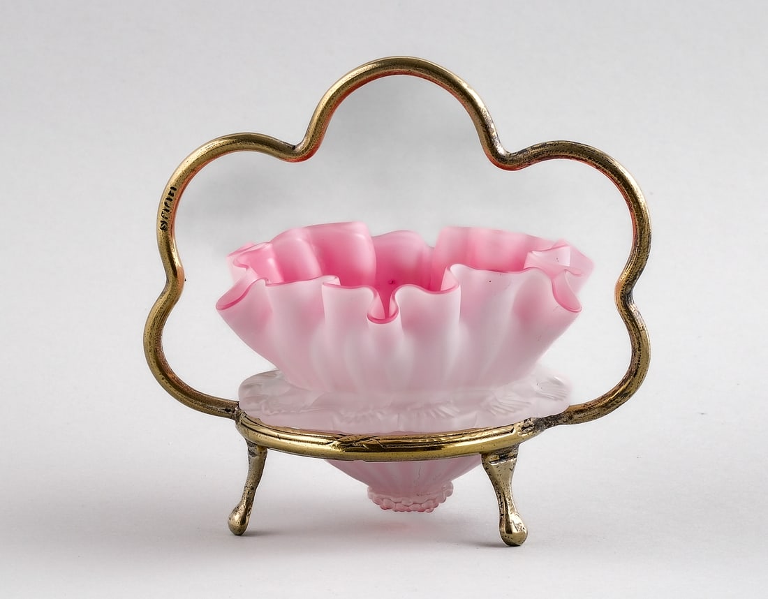 Pink Victorian Air-Trap Art Glass: A pink Victorian air-trap satin art glass open salt., opaque white to pink with a satin finish, ruffled rim with applied satin medial band of rigaree, applied lower prunt, fitted into a mixed metals s