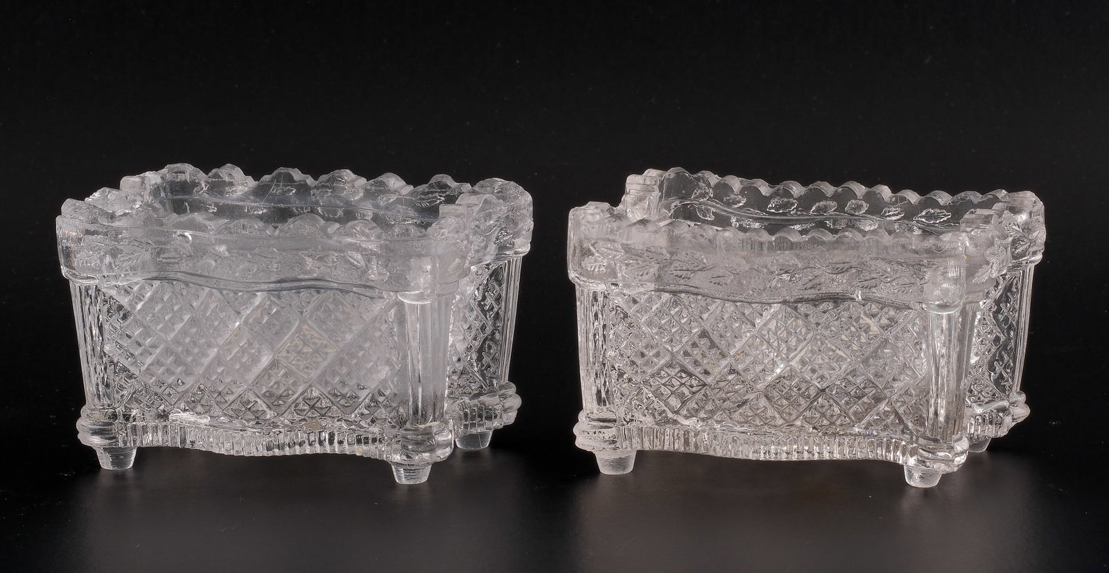 2 Strawberry and Diamond Lacy Salts: 2 Clear glass strawberry diamond Sandwich salts with curved, indented sides and wavy. 3" X 1 3/4" X 1 7/8". In veyr minor nicks to rims.
