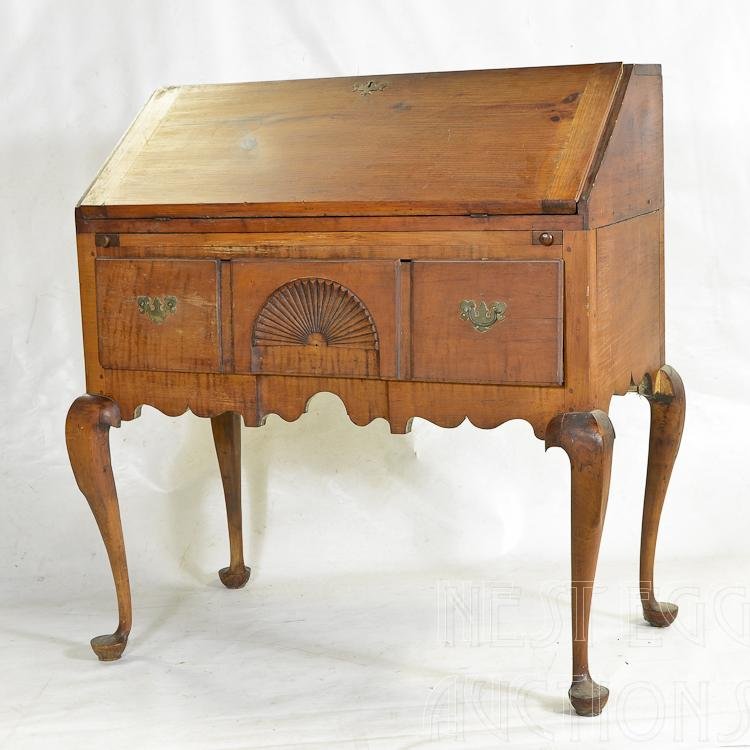 Queen Anne Highboy Converted To Desk: Queen Anne highboy base converted to slant top desk. Base is tiger maple and maple, added desk top is pine, pine secondary wood. Bottom case: Three horizontal drawers, with central drawer having fan c