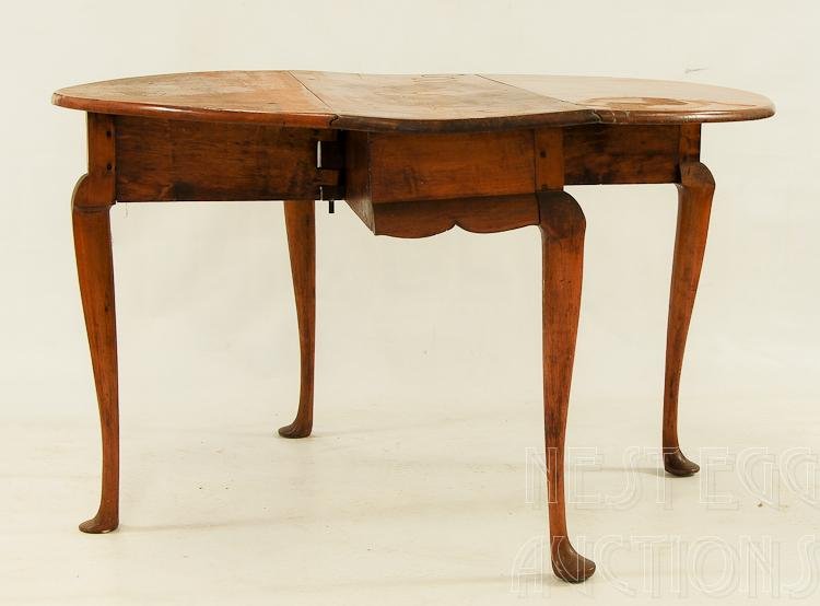 New England Cherry Queen Anne Drop Leaf Table: Country Queen Anne drop leaf table. Cherry. Likely New England origin. Swing leg, rounded leaves. Cabriole leg terminating on pad feet. Mid to late 18th century. Old refinish. 28 H x 46 W x 14 D (clos