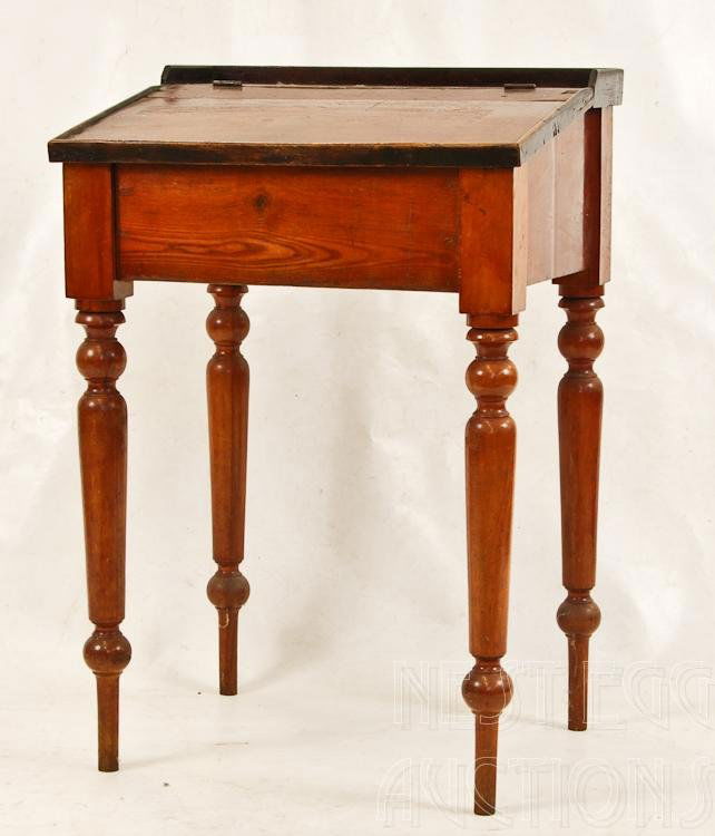 New England Lift Top School Desk: 19th Century New England lip top school desk. Cherry & pine, turned legs, old refinish. Measures approximately 33" x 22" x 19.5" 