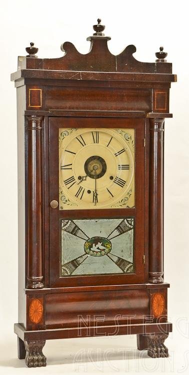 Early 19th. C. Seth Thomas Shelf Clock: Seth Thomas shelf clock. Mahogany and mahogany veneer case. Scroll crest with urn finials. Single door with reverse painting glass tablet, having white dove motif, flanked by full columns. Ogee elemen