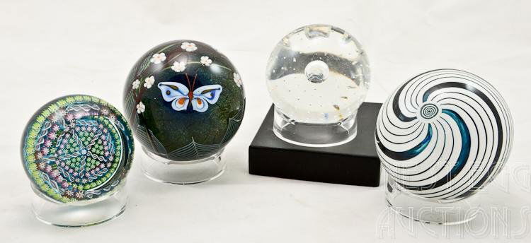 Four Art Glass Paperweights Perthshire: Group of four art glass paperweights. Two are by Perthshire, one is Orient & Flume of Chico, California, signed and dated 1978 and the last is unsigned. Sizes range from approximately 3" in diameter t