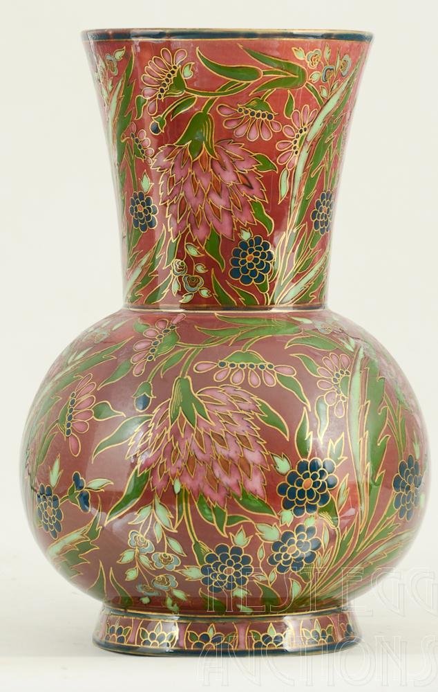 Zsolnay pottery vase with inlayed flowers 669/32: Zsolnay enamel decorated pottery ; vase with gold inlayed flowers measuring 12 inches tall. Minor shelf wear Noted on the bottom # 669 / 32