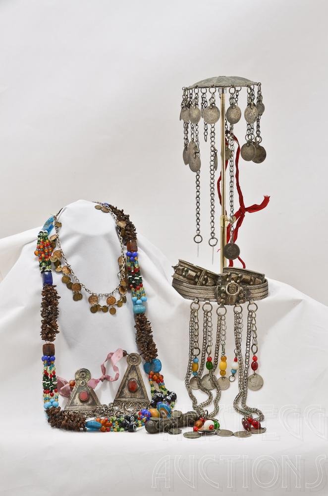 Group of Middle Eastern Bedouin Style Jewlery: Includes silver coin and chain headpiece, Necklace with silver coins(5" Wide, 12" long), two bracelets (each approx 3") A 20" long Clove, tin, and silver Art glass bead necklace, plus three additional