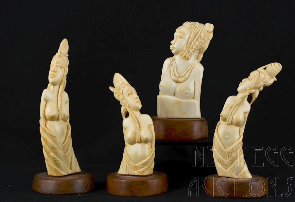 four pieces of carved African Ivory: Approximately 5.5" Each, tusks carved into female busts on wood bases. This item is not eligible for shipping out of state or internationally. This lot must be picked up by the buyer or agent for the