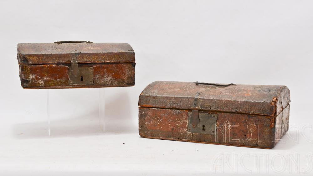 Two 18th Century Leather Covered Document Boxes: Both from a New Haven CT Estate. Both with leather & hinge loss. Hand wrought iron hardware. The smaller (10" x 4" x 6")lined with period newspaper, The Larger (12" x 5" x 7") with painted yellow inte