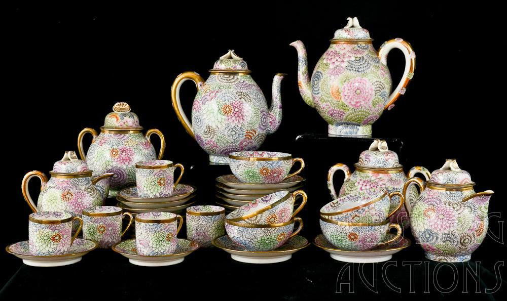 Japanese Meiji Floral Satsuma Porcelain Tea Set: All Over Floral Decoration on fine, thin, eggshell porcelain, Signed by artist or maker in gilt paint in a black cartouche, also signed "Dai Nippon" or "Great Japan" 40 Pieces total, with the teapots