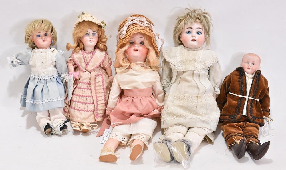 Five antique German & French porcelain dolls: Doll sizes vary from 11" to 16" each with porcelain heads, that appear to be intact (no major repairs found under blacklight) one head with replaced modern eyes. Bodies, hair and clothing ar