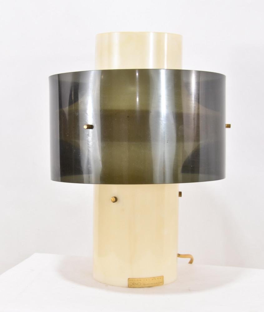 Yki Nummi Orno plastic modern table lamp: Original Label, plastic needs to be cleaned. cord is dry and needs to be cleaned. Working, no damage to plastic. Made in Finland, one hardware piece missing from side of shade. 14" x 10"