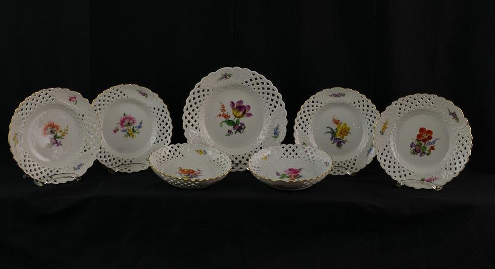 7 pcs Royal Meissen German porcelain: 7 pieces of open work porcelain with hand painted flowers. crossed blue swords underglaze mark with double scratch strike-through (second). one large 11" serving dish, four 9.5" plates, and