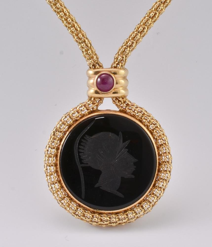 14K cameo & intaglio reverseable necklace: High quality mother of pearl carved cameo in the art nouveau style with green cabochon set above, and a black carved intaglio with red cabochon set above on the reverse. Cameo (1" diameter) is su