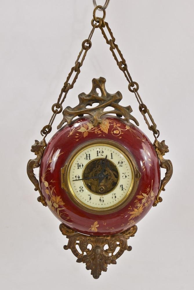 French porcelain & ormolu chatelaine wall clock: The hanging clock most likely from the second half of the 19th Century, is decorated in figural ormolu and gilt painted porcelain. appears complete, back could not be removed, maker unknown. 14"