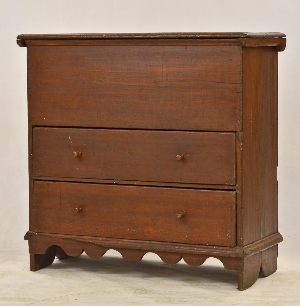 Country primitive lift top blanket chest: nicely scalloped apron, old finish, traces of old grey paint to the back, minor repairs and losses, feet are cut down, overall very good. 40" H x 42" W x 18" D