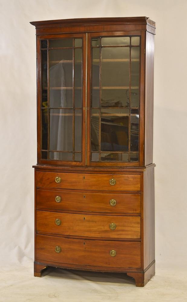 Hepplewhite bow front step back cupboard: A period American Antique in good original condition. One piece of cornice molding missing from right side, Possibly original pulls, original glass, Old Finish, 79" H x 36" W x 15" D