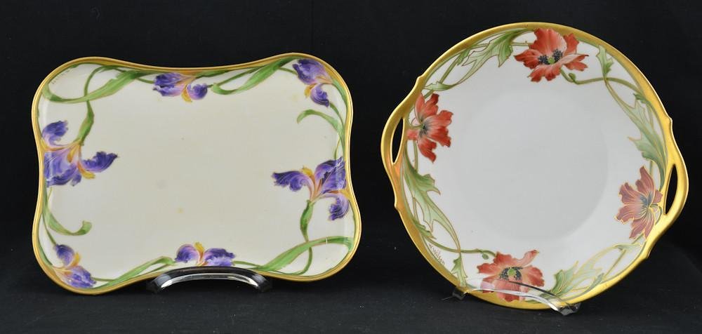 two Walter Wilson hand painted porcelain trays: Rectangular tray with gilt and purple iris measuring 11" x 8" and a round handled tray with red flowers 10.5" diameter. Both in excellent condition, no damage, chips, cracks, or repairs