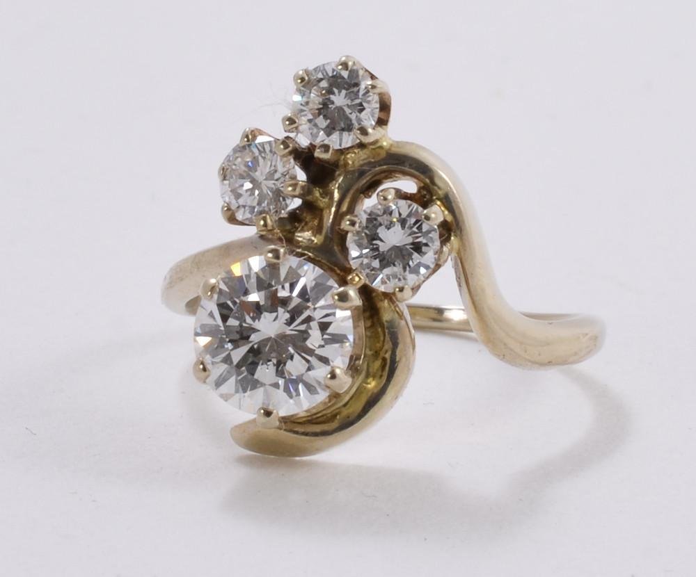 Ladies 14K White Gold & Diamond Cocktail ring: Center diamond with an approximate weight of 1 CT, with three .2 CT side diamonds marked 14K inside band, excellent condition, Size 6.5, total weight 2.1dwt / 3.5g