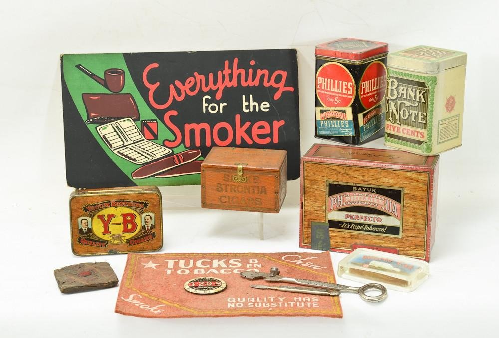 12 pcs Cigar & Tobacco Advertising items: Includes a White Cat Glass Paperweight, 3-20-8 Clock style mirror, A counter Felt for Tucks Tobacco, Two Cigar Box openers, A J.M. Anthony Strontia cigars box, a Bank Note five cent cigar tin, and Phi