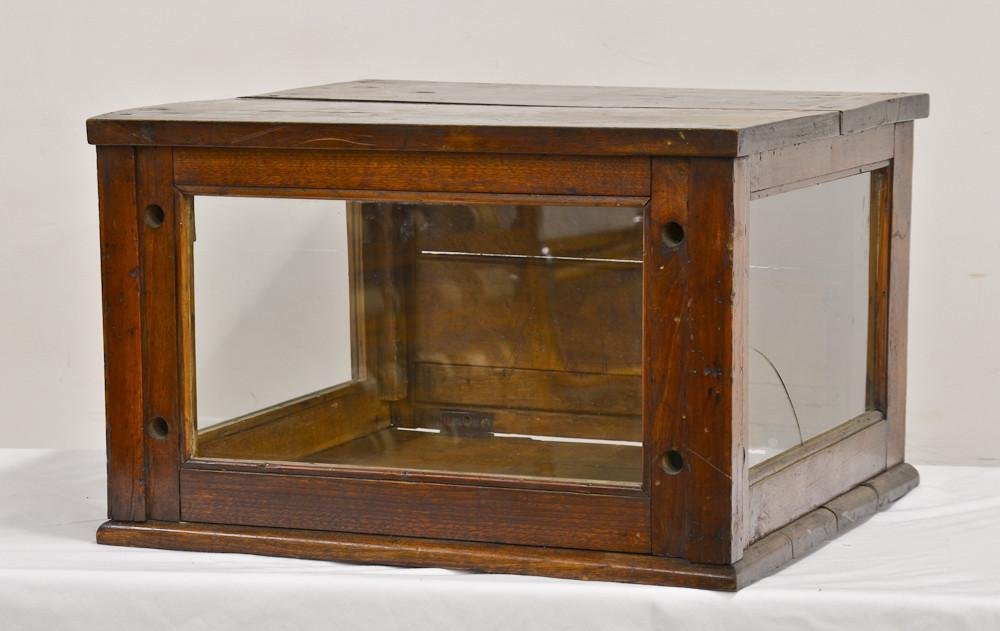 Country Store Walnut Display Case: Glass counter top display case. Three sided glass, possibly a pie case. old finish, 14" Tall, 22" Deep, 22" Wide. overall good condition.