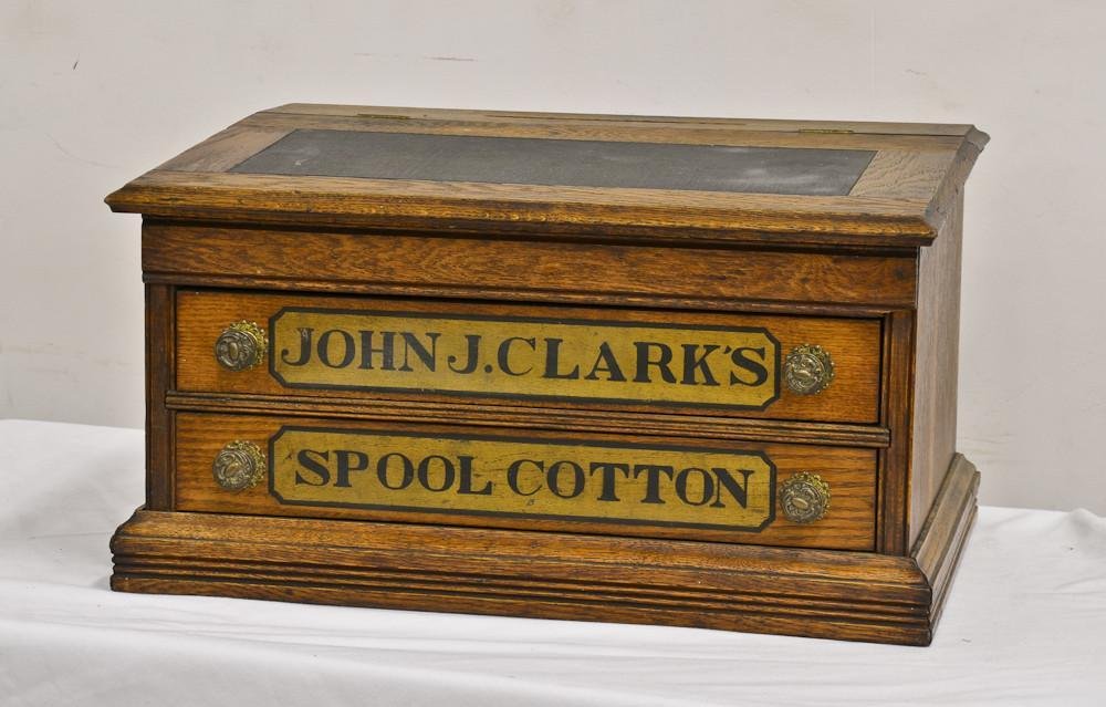 John J. Clarks Spool Cotton Cabinet: Great country store counter top Display and Advertising piece with original labels. Two-Draw and lift top design. Very good original condition. 12" Tall, 21" Wide, 15.5" Deep.