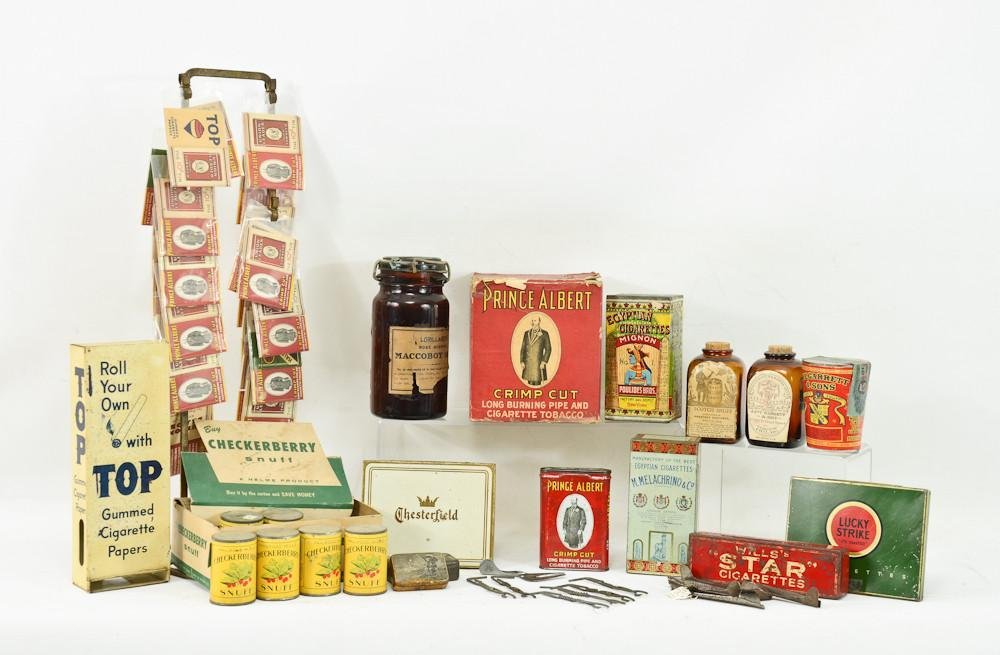 Cigarette and Snuff Tobacco advertising lot: includes counter top stand with Prince Albert rolling papers, a cardboard box of Prince Albert Crimp cut, 2 Egyptian tin Cigarette boxes, Lucky Strike, chesterfield, Checkerberry Snuff, Wills's Star C