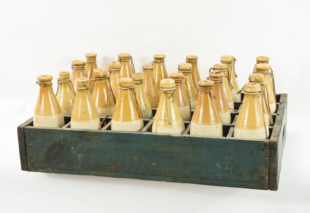 Wood Case with stoneware soda or beer bottles: Possibly mead bottles. 24 bottles in good condition, unmarked green painted wood case. bottles are all similar but do not match perfectly. 17" x 24" x 10"