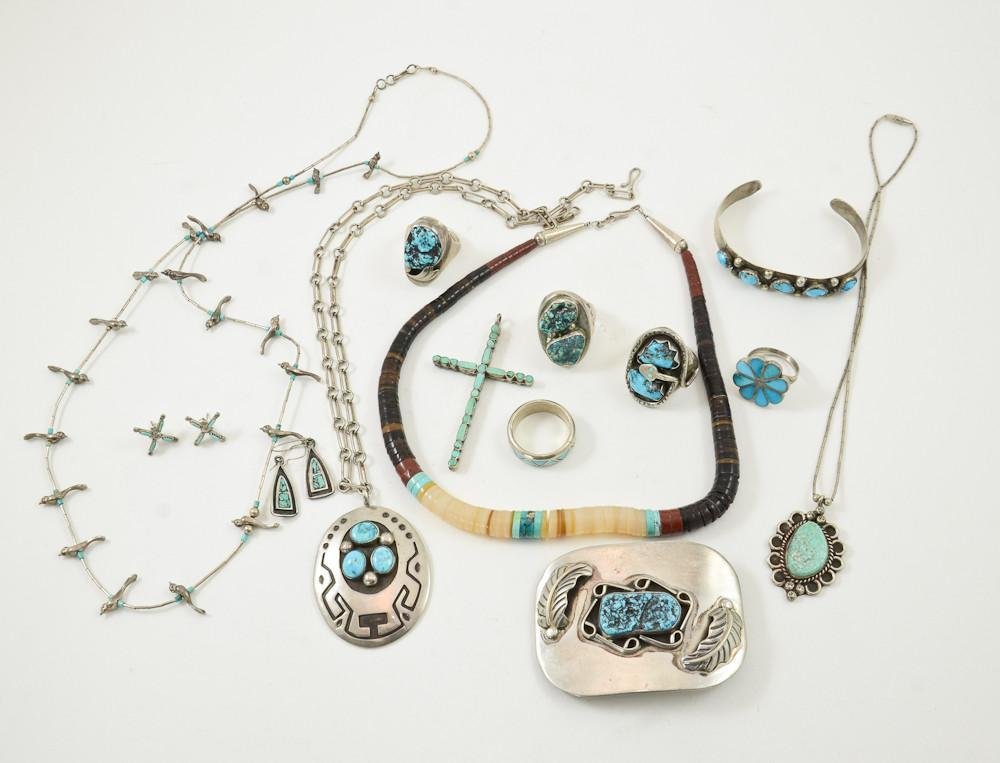 14 pcs Native American and Silver Jewelry: Five Silver rings (mens and ladies) one marked Effie C. Zuni, a silver and turquoise effigy bird form necklace, a silver and turquoise belt buckle, two silver pendants with chain, and two pairs of ear