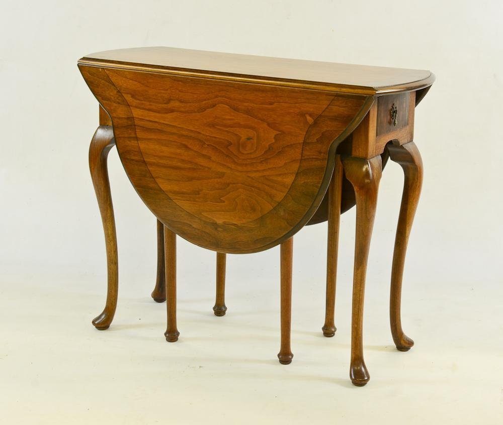 Lenox Queen Anne Drop Leaf Table: Solid Cherry, One Drawer, Mid 20th Century. Measurements: 29" H x 36" W x 15.5" L (closed) and 48" L (Open), Excellent condition.