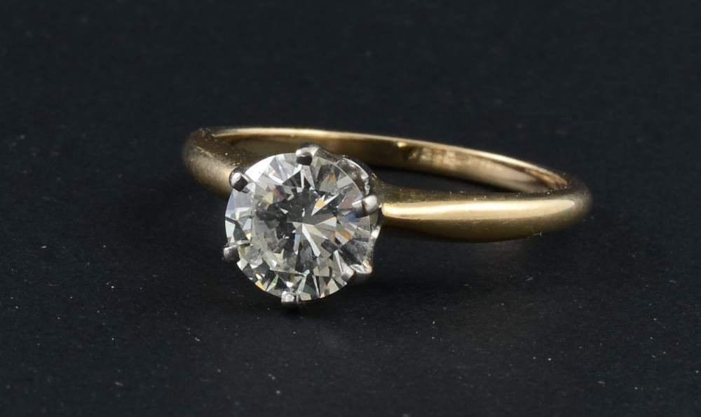 14K Diamond Solitaire Engagement Ring: This beautiful round cut Diamond has been inspected by a certified Gemologist. It is approximately 1.1 CT, VS2 Clarity and H Color. Set in a standard six-prong Tiffany style 14K setting.