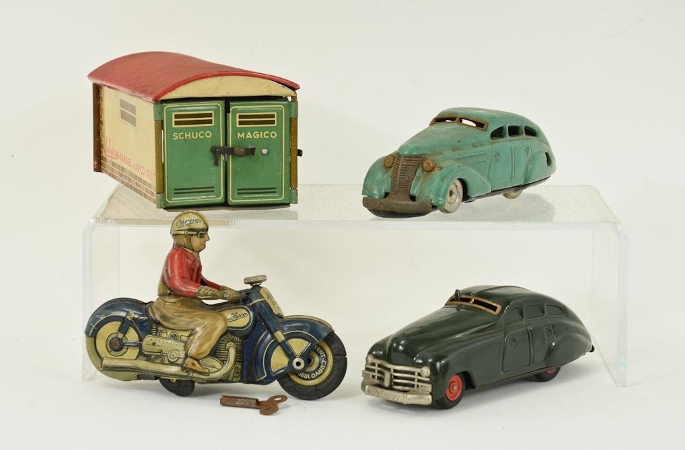 Group of Schuco German Tin Toys: Two Clockwork cars: 1010 and 1750, along with a SChuco Magico 500 Garage, and a Curvo 1000 Motorcycle. all pieces have light rust, paint wear and function at least a little. Motorcycle has front wheel