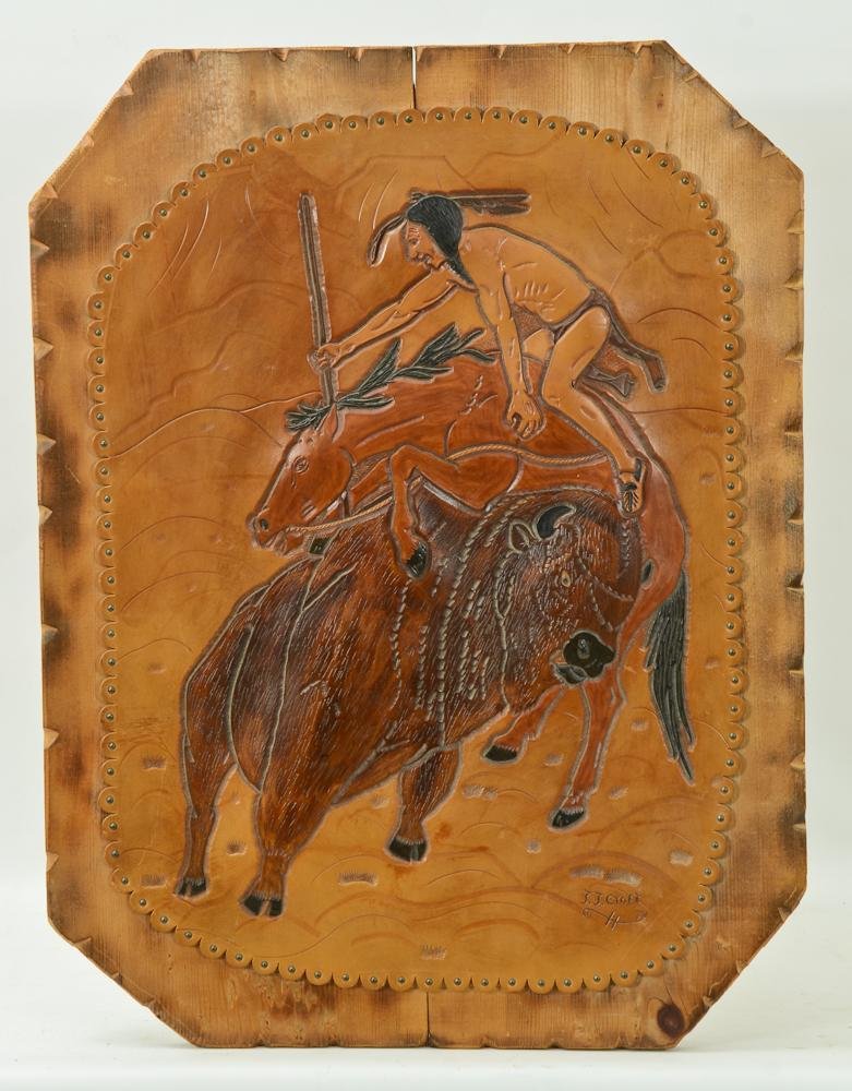 Jerry Jay Croft Southwest Indian Art: This Native American leather plaque is a hand tooled scene of an Indian killing a buffalo from horseback. Tacked to a carved wood board, signed J.J. Croft lower right. JJ Croft is well known from his 