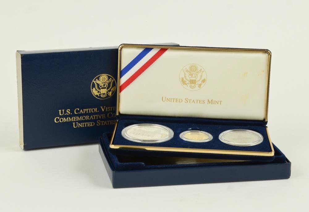 2001 US Capitol Commemorative 3 Coin Proof Set: 2001 Capitol Visitor Center Commemorative coins: Three-Coin Proof Set. Set Contains one five dollar West Point Proof Gold Coin (90% gold, 8.5g) along with one Philadelphia Proof Silver Dollar (90%, 26